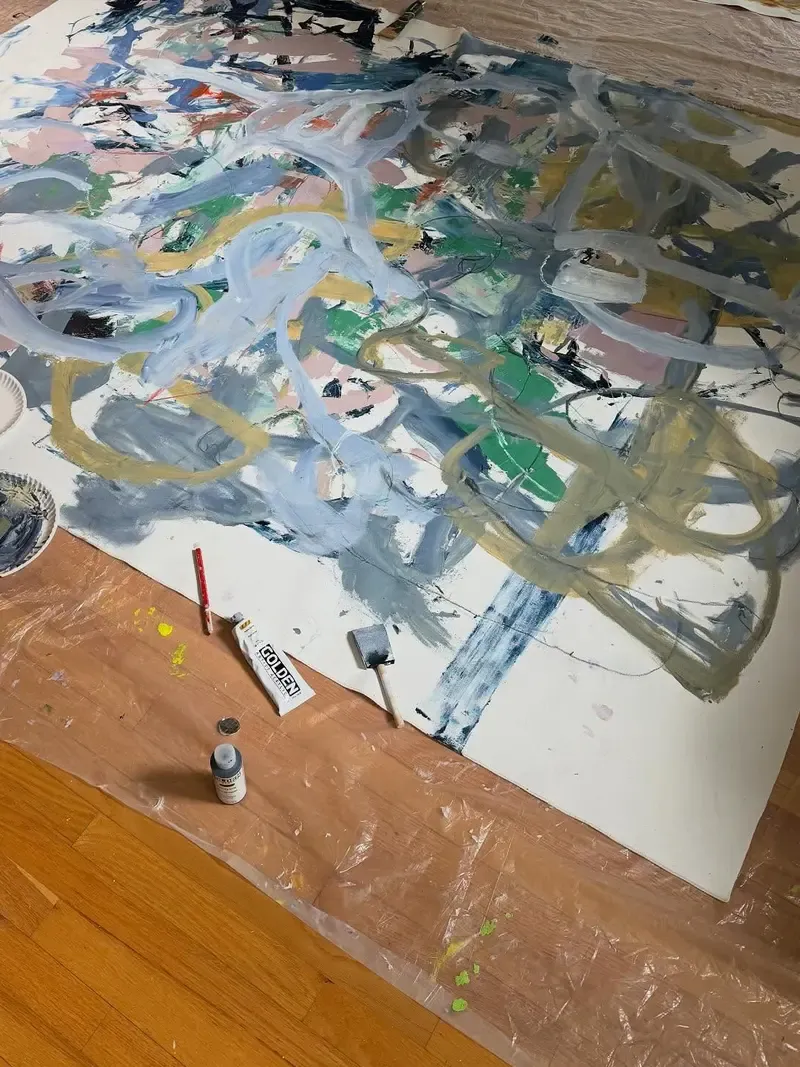 Miles Fink painting on the studio floor